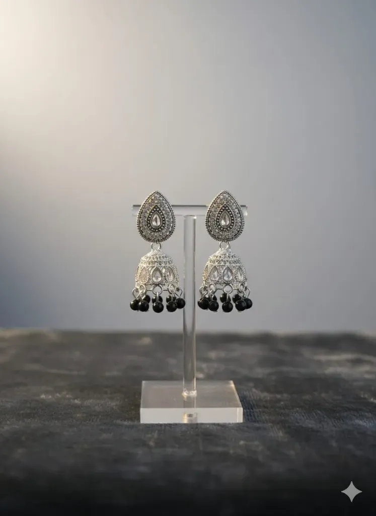 Silver-plated jhumka earrings with black stone